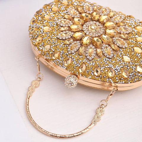 https://rario10.com.br/products/bolsa-clutch-redonda-dourada-de-luxo-com-diamantes?_pos=1&_sid=b9355f31d&_ss=r&variant=41901961609306
