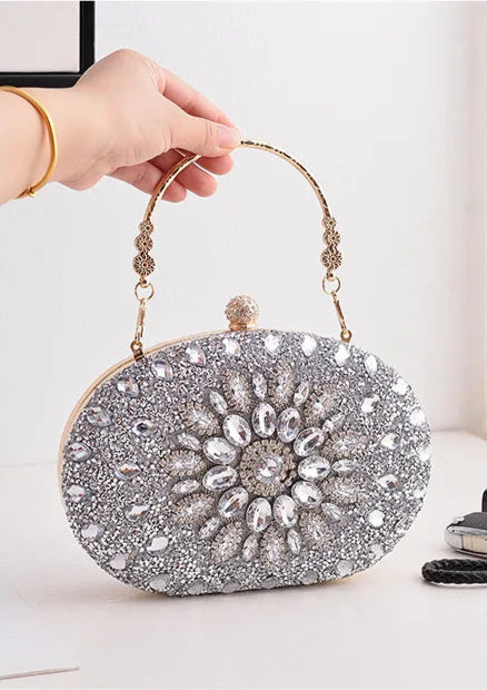 https://rario10.com.br/products/bolsa-clutch-redonda-dourada-de-luxo-com-diamantes?_pos=1&_sid=b9355f31d&_ss=r&variant=41901961609306