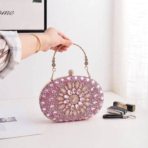 https://rario10.com.br/products/bolsa-clutch-redonda-dourada-de-luxo-com-diamantes?_pos=1&_sid=b9355f31d&_ss=r&variant=41901961609306