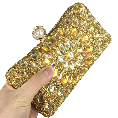 https://rario10.com.br/products/bolsas-e-clutches-femininas-douradas-com-fecho-de-perola-sintetica?_pos=1&_sid=d15e5f986&_ss=r&variant=41905656463450